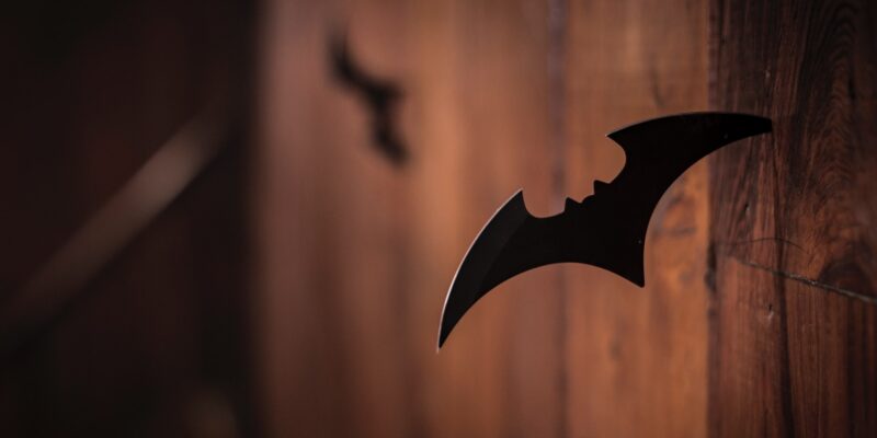 closeup photo of shuriken on wood